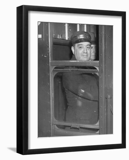 Nyc Mayor Fiorello Laguardia Wearing Motorman's Cap and Looking Out Window on Subway-null-Framed Photographic Print