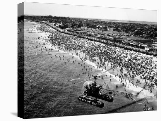 NYC Police Helicopter Hovering over Independence Day Crowd at Beach at Far Rockaway-null-Stretched Canvas