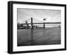 NYC Police Helicopter Hovering over the East River Next to the Manhattan Bridge-null-Framed Photographic Print