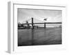 NYC Police Helicopter Hovering over the East River Next to the Manhattan Bridge-null-Framed Photographic Print