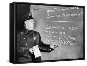 NYC Police Officer Practices Basic Spanish Phrases Written on Blackboard, Ca. 1955-null-Framed Stretched Canvas