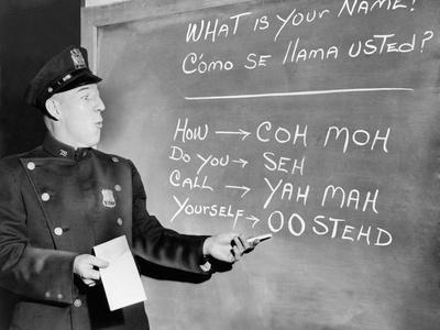 https://imgc.allpostersimages.com/img/posters/nyc-police-officer-practices-basic-spanish-phrases-written-on-blackboard-ca-1955_u-L-PIHCRP0.jpg?artPerspective=n