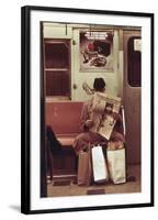 NYC Subway Passenger Reading Newspaper with Shopping Bags in May 1973-null-Framed Photo