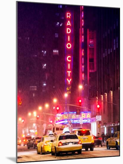 NYC Yellow Taxis in Manhattan under the Snow in front of the Radio City Music Hall-Philippe Hugonnard-Mounted Photographic Print