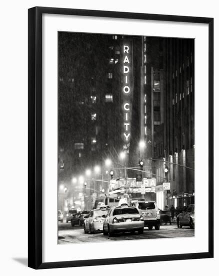 NYC Yellow Taxis in Manhattan under the Snow in front of the Radio City Music Hall-Philippe Hugonnard-Framed Photographic Print