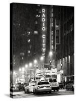 NYC Yellow Taxis in Manhattan under the Snow in front of the Radio City Music Hall-Philippe Hugonnard-Stretched Canvas