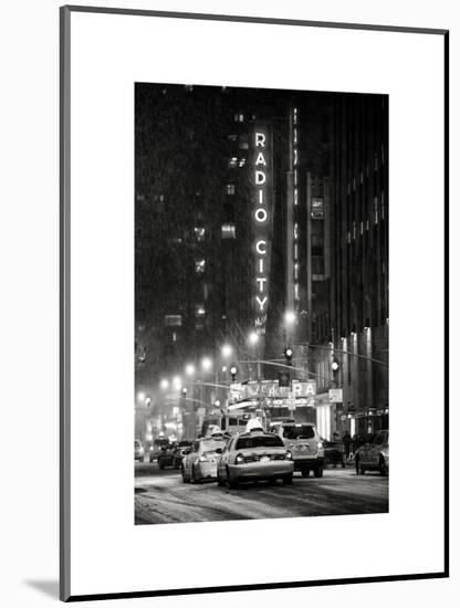 NYC Yellow Taxis in Manhattan under the Snow in front of the Radio City Music Hall-Philippe Hugonnard-Mounted Art Print