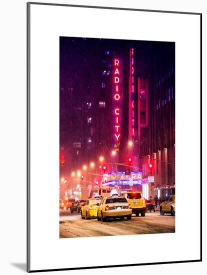 NYC Yellow Taxis in Manhattan under the Snow in front of the Radio City Music Hall-Philippe Hugonnard-Mounted Art Print