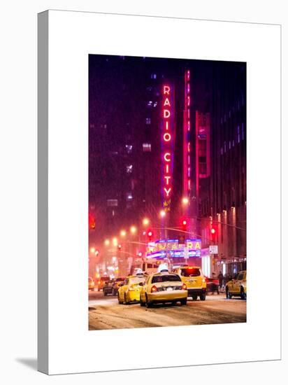 NYC Yellow Taxis in Manhattan under the Snow in front of the Radio City Music Hall-Philippe Hugonnard-Stretched Canvas