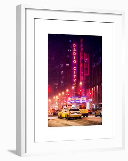 NYC Yellow Taxis in Manhattan under the Snow in front of the Radio City Music Hall-Philippe Hugonnard-Framed Art Print