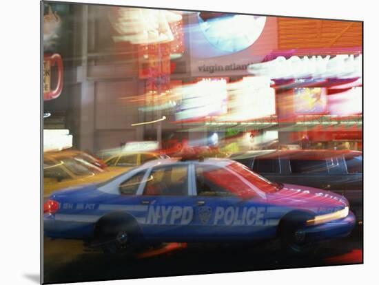 Nypd Police Car Speeding Through Times Square, New York City, New York, USA-null-Mounted Photographic Print