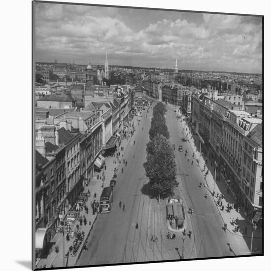 O'Connell St, Lack of Cars Has Made Dublin's Leaves Greener, Horses Have Caused New Influx of Flies-David Scherman-Mounted Photographic Print