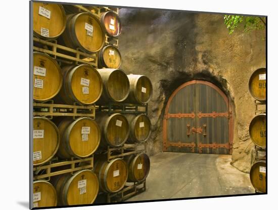 Oak Barrels Stacked Outside of Door at Ironstone Winery, Calaveras County, California, USA-Janis Miglavs-Mounted Photographic Print