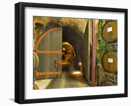 Oak Barrels Stacked Outside of Open Door To Aging Caves at Ironstone Winery, California, USA-Janis Miglavs-Framed Photographic Print