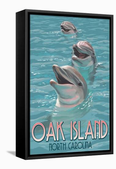 Oak Island, North Carolina - Dolphins Swimming-Lantern Press-Framed Stretched Canvas