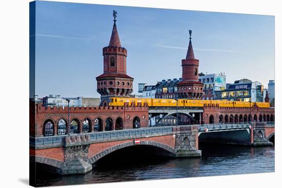 Oberbaum Bridge across River Spree between Friedrichshain and Kreuzberg, Berlin Germany-null-Stretched Canvas