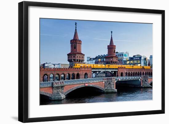 Oberbaum Bridge across River Spree between Friedrichshain and Kreuzberg, Berlin Germany-null-Framed Art Print