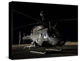 OH-58D Kiowa Sits on its Pad at Night-Stocktrek Images-Stretched Canvas