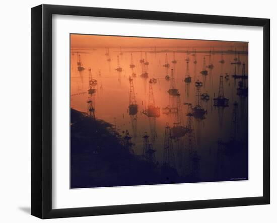 Oil Rigs Dating from the 1920's Dot the Shallows of Galveston Bay-Ralph Crane-Framed Photographic Print