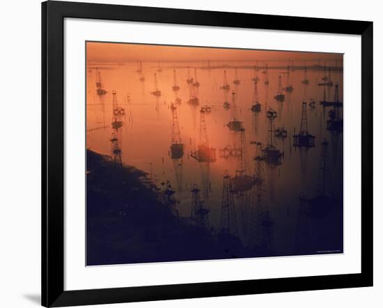 Oil Rigs Dating from the 1920's Dot the Shallows of Galveston Bay-Ralph Crane-Framed Photographic Print