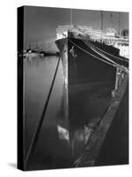 Oil Tanker Tied Up at Dock While it Is Being Loaded with Barrels of Oil-Margaret Bourke-White-Stretched Canvas