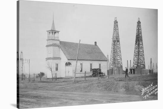 Oil Well Construction behind Church-null-Stretched Canvas