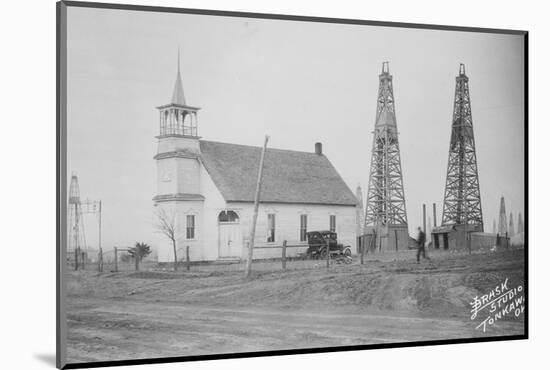 Oil Well Construction behind Church-null-Mounted Photographic Print