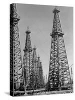 Oil Well Rigs in a Texaco Oil Field-Margaret Bourke-White-Stretched Canvas