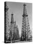 Oil Well Rigs in a Texaco Oil Field-Margaret Bourke-White-Stretched Canvas