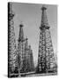 Oil Well Rigs in a Texaco Oil Field-Margaret Bourke-White-Stretched Canvas