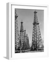 Oil Well Rigs in a Texaco Oil Field-Margaret Bourke-White-Framed Photographic Print