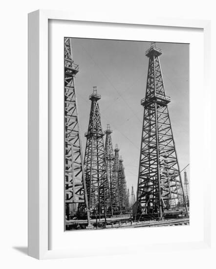 Oil Well Rigs in a Texaco Oil Field-Margaret Bourke-White-Framed Photographic Print