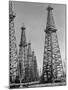 Oil Well Rigs in a Texaco Oil Field-Margaret Bourke-White-Mounted Photographic Print