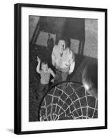 Oklahoma A&M Basketball Coach Hank Iba Watching a Young Boy Shooting a Basket-Myron Davis-Framed Photographic Print