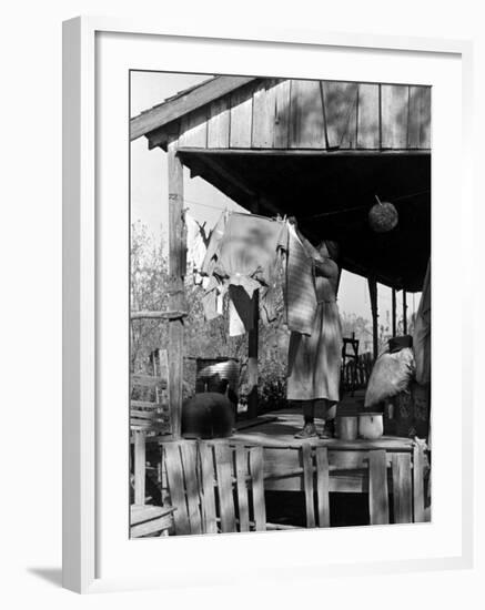 Old African American, Wife of Sharecropper, Lizzie Alexander Hanging Laundry to Dry on Her Porch-Alfred Eisenstaedt-Framed Photographic Print