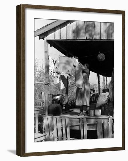 Old African American, Wife of Sharecropper, Lizzie Alexander Hanging Laundry to Dry on Her Porch-Alfred Eisenstaedt-Framed Photographic Print