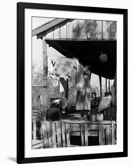 Old African American, Wife of Sharecropper, Lizzie Alexander Hanging Laundry to Dry on Her Porch-Alfred Eisenstaedt-Framed Photographic Print