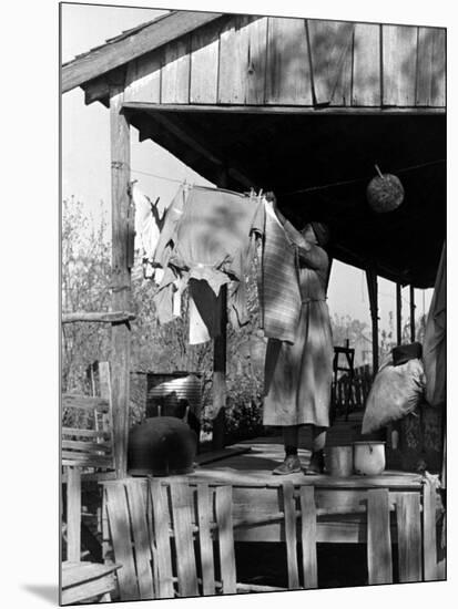Old African American, Wife of Sharecropper, Lizzie Alexander Hanging Laundry to Dry on Her Porch-Alfred Eisenstaedt-Mounted Photographic Print