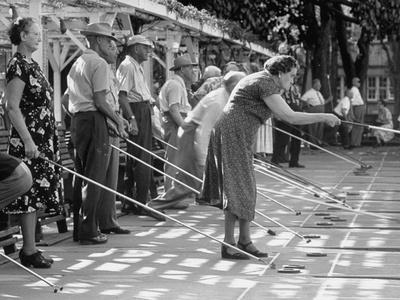 &lsquo;Old Age Essay: Seniors Playing Shuffleboard&rsquo; Photographic Print