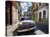 Old American Plymouth Car Parked on Deserted Street of Old Buildings, Havana Centro, Cuba-Lee Frost-Stretched Canvas