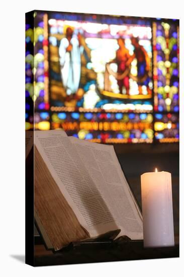 Old Bible and church candle, Carouge Protestant temple, Geneva, Switzerland-Godong-Stretched Canvas