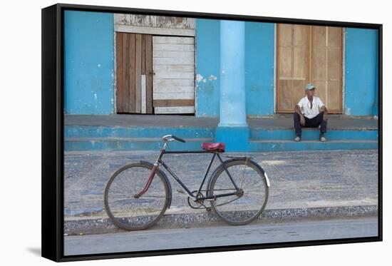 Old Bicycle Propped Up Outside Old Building with Local Man on Steps-Lee Frost-Framed Stretched Canvas