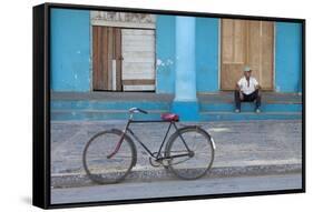 Old Bicycle Propped Up Outside Old Building with Local Man on Steps-Lee Frost-Framed Stretched Canvas