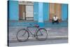 Old Bicycle Propped Up Outside Old Building with Local Man on Steps-Lee Frost-Stretched Canvas