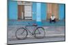 Old Bicycle Propped Up Outside Old Building with Local Man on Steps-Lee Frost-Mounted Photographic Print