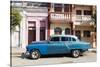 Old blue American car parked in front of old buildings, Cienfuegos, Cuba-Ed Hasler-Stretched Canvas