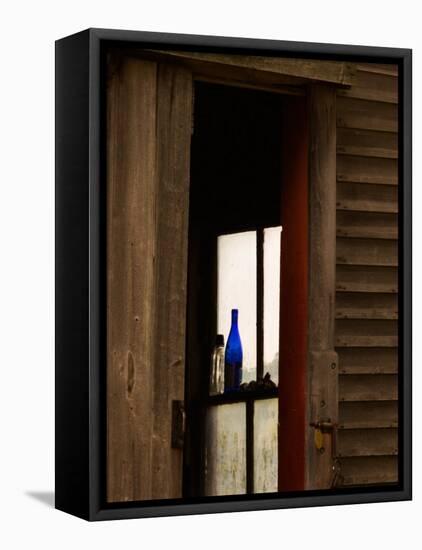 Old Blue Bottle in Window of Barn in Rural New England, Maine, USA-Joanne Wells-Framed Stretched Canvas