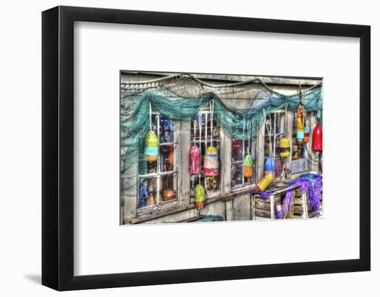 Old building, Netarts, Oregon. Decorated with colorful fishing gear.-Darrell Gulin-Framed Photographic Print