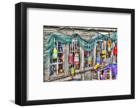 Old building, Netarts, Oregon. Decorated with colorful fishing gear.-Darrell Gulin-Framed Photographic Print