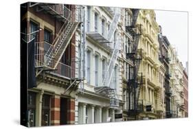 Old buildings and fire escapes in the Cast Iron District of SoHo, Manhattan, New York City, United -Fraser Hall-Stretched Canvas